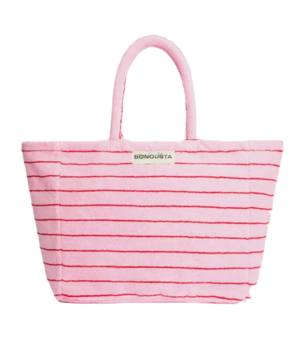 Bolso de playa weekend de Bongusta en tejido toalla rayas rosas y rojas: amplio, cómodo y perfecto para llevar lo imprescindible en escapadas de fin de semana o días de playa.