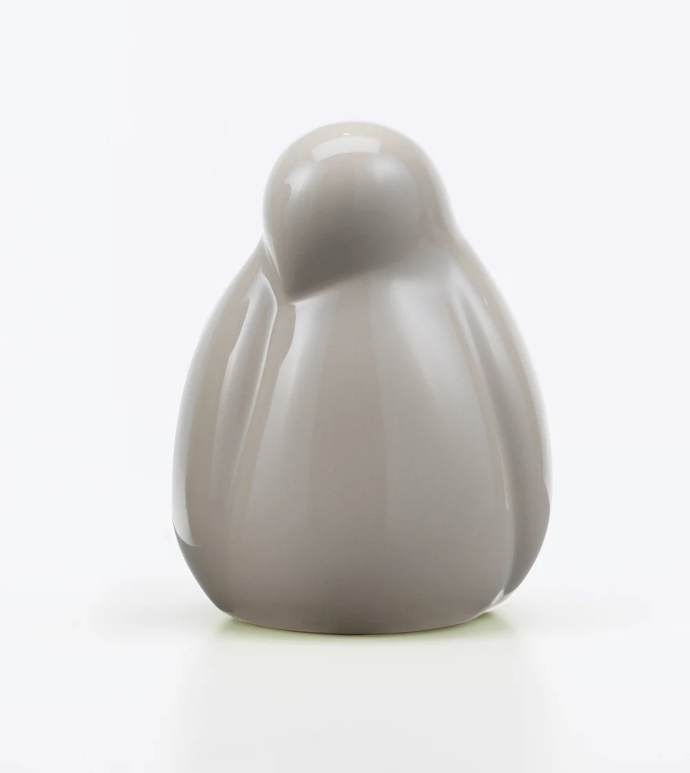 resting bird arena. figura de cerámica con forma de pájaro gris