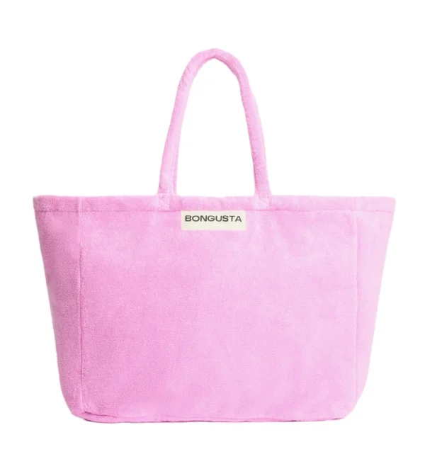 Bolso weekend de Bongusta en tejido toalla fucsia: amplio, cómodo y perfecto para llevar lo imprescindible en escapadas de fin de semana o días de playa.