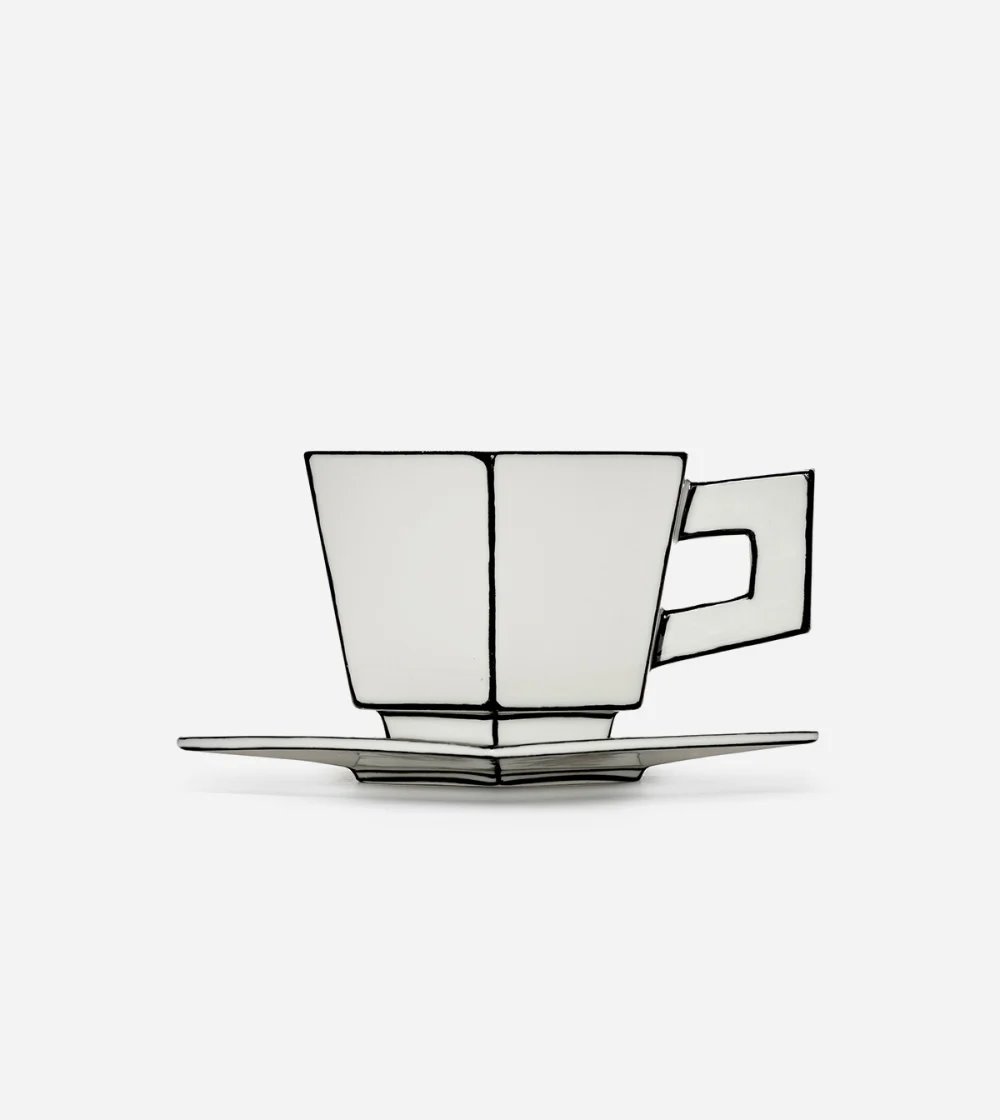 Taza de cappuccino con platillo Carte Blanche de Serax en blanco y negro, diseñada por Annebet Philips.