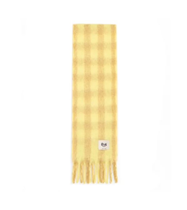 Bufanda Stripy Vichy de Ezcaray en mohair y lana, con estampado de cuadros bicolor en amarillo y beige y flecos.