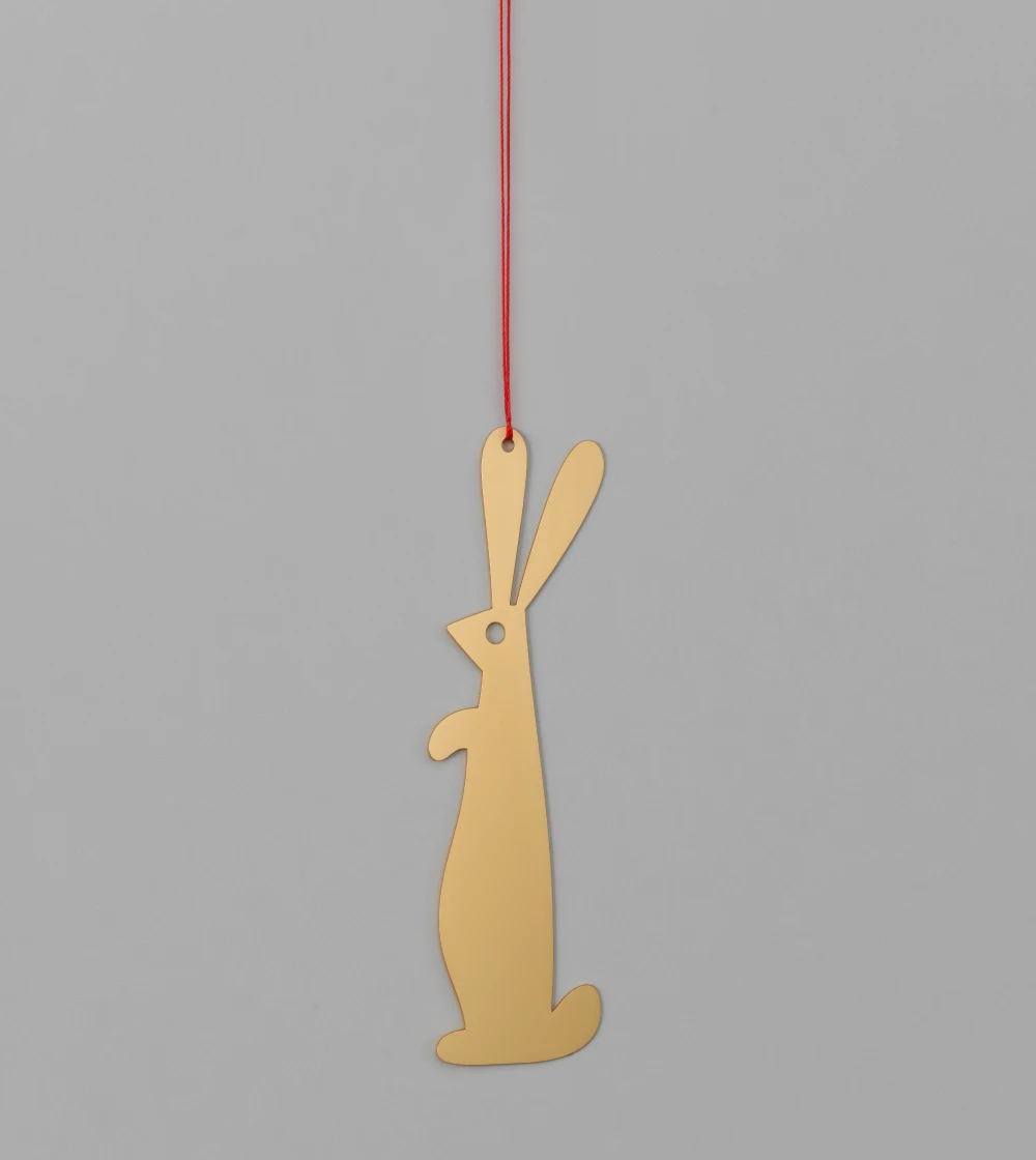 Adorno de navidad dorado con forma de paloma de la colección Girard Ornaments de Vitra diseñado por Alexander Girard, elaborado en metal con efecto latón pulido y disponible en distintos formas.